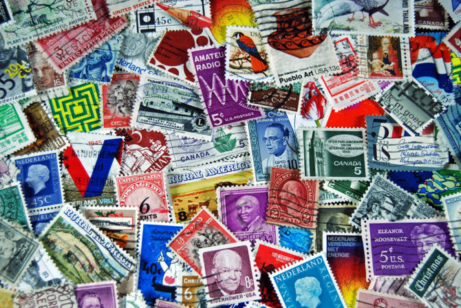How are British postage stamps designed?
