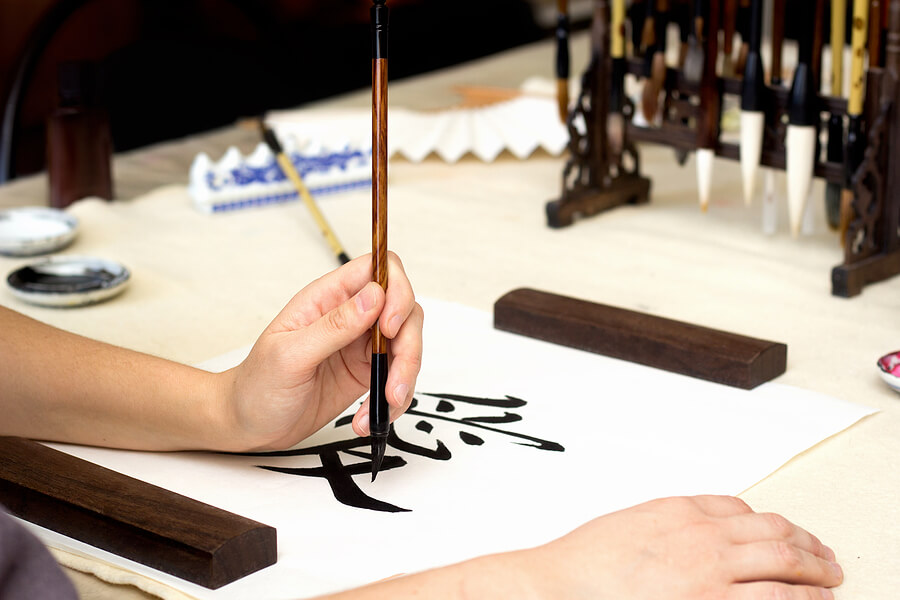 Traditional Chinese calligraphy Master writing character translation means love. Asian art equipment and tools