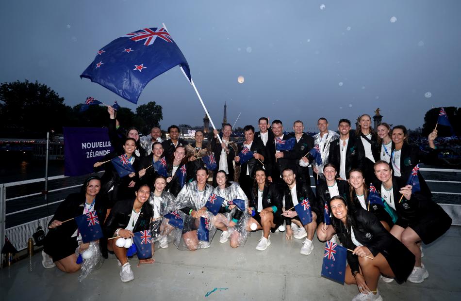 The New Zealand delegation poses for a photo during their cruise up the River Seine as part of...