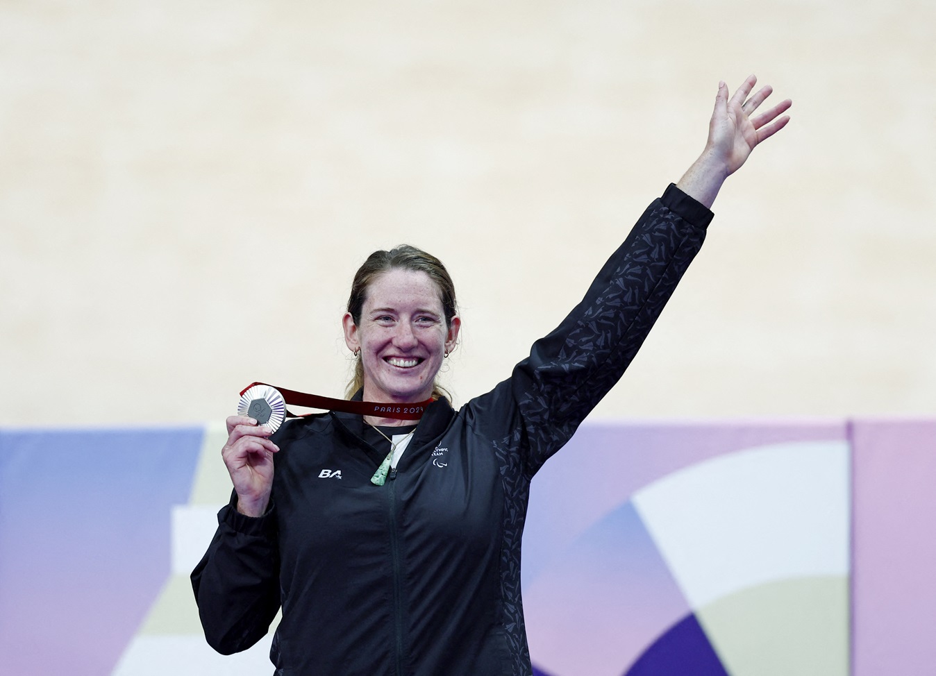 New Zealand's Anna Taylor celebrates with her silver medal on the podium. Photo: Reuters