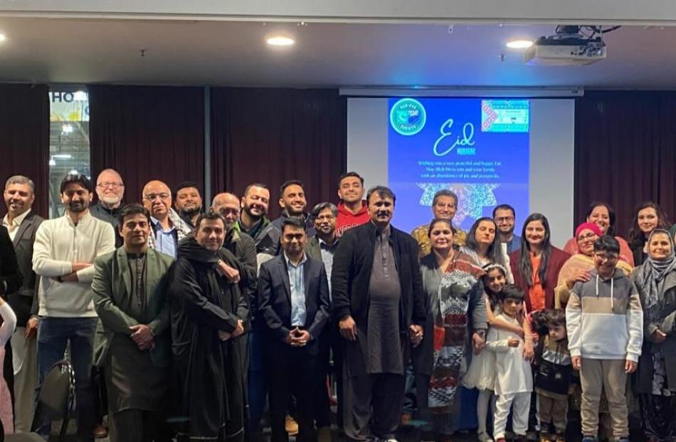 Attendees of the event pose for a group photo
