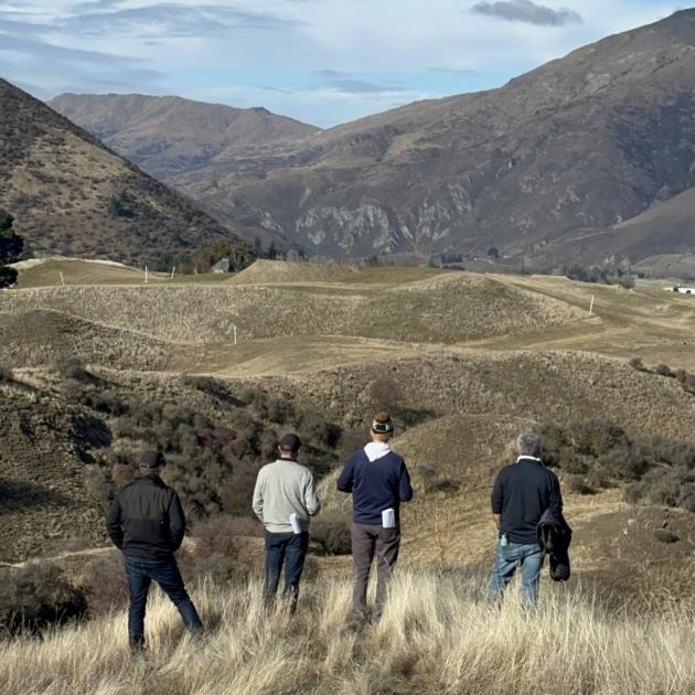 Looking over the proposed new Hogan Gully golf course earlier this year are (from left) course...