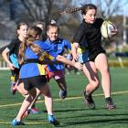 Valerie Beatson, 11, of Anderson’s Bay School, tries to beat the Strath Taieri defence. PHOTOS:...