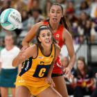Dakota Thomas (rear) in action for the Swifts against the Lightning on the Gold Coast last year....